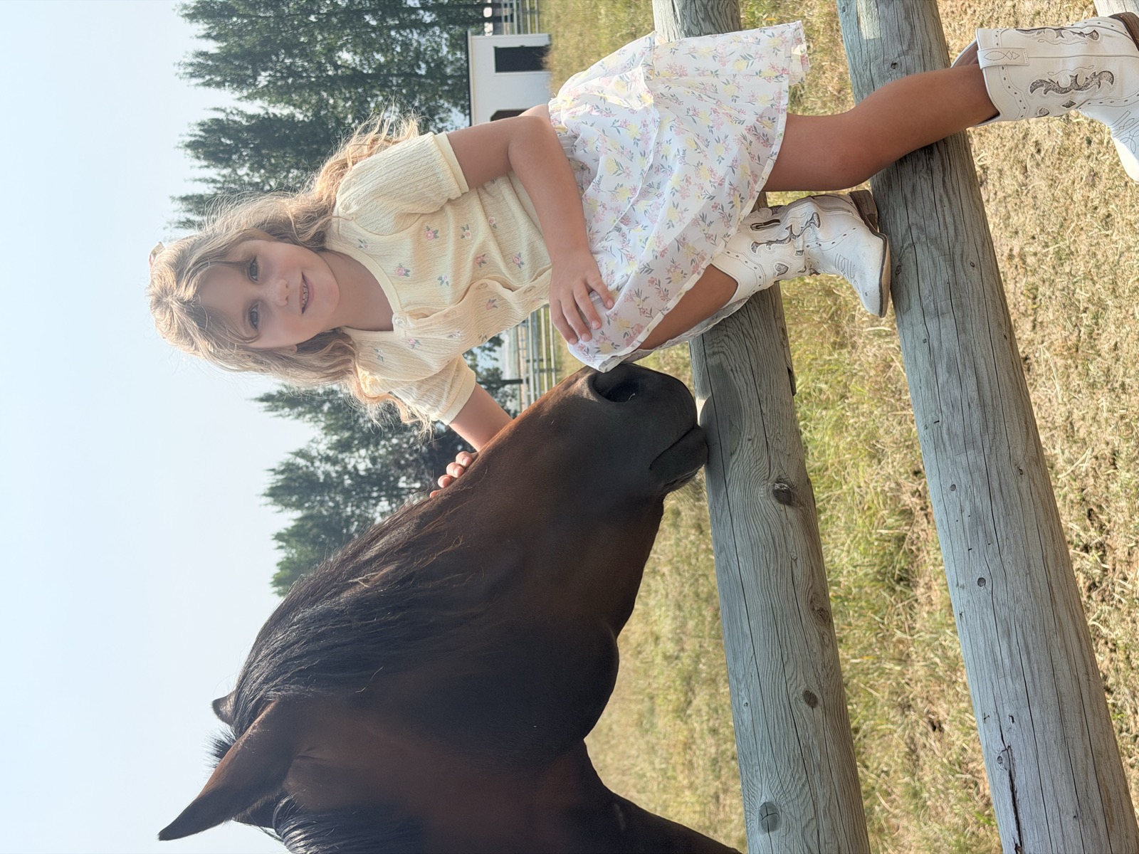 Joy, the sanctuary's resident mare, with one of our kids